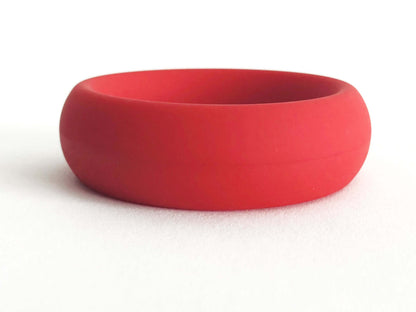 Red silicone cock ring with a smooth, non-roll design for comfort and strong support.