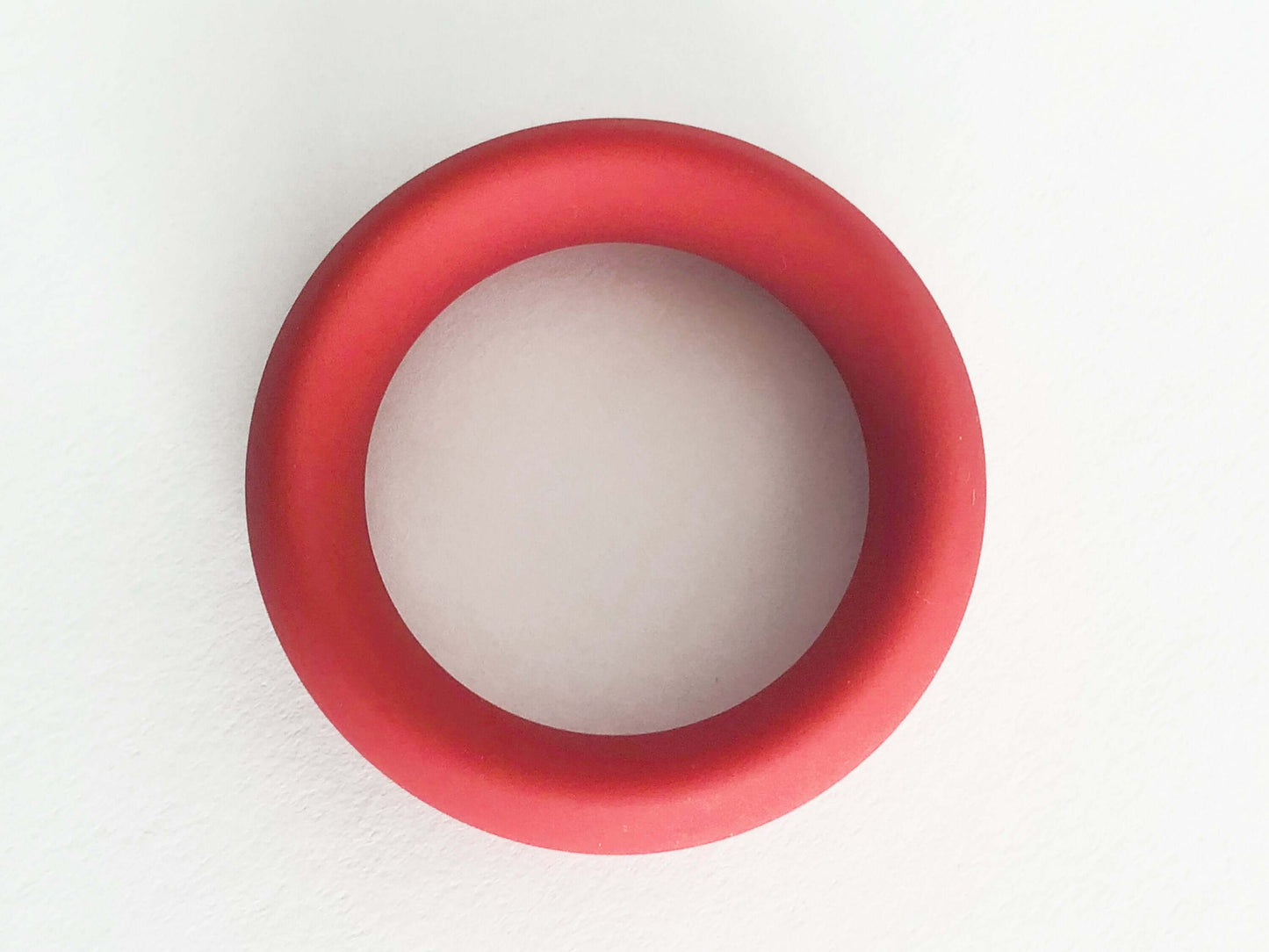 Red silicone cock ring, 3X stretch for comfort, non-roll design, thick girth for powerful erections.